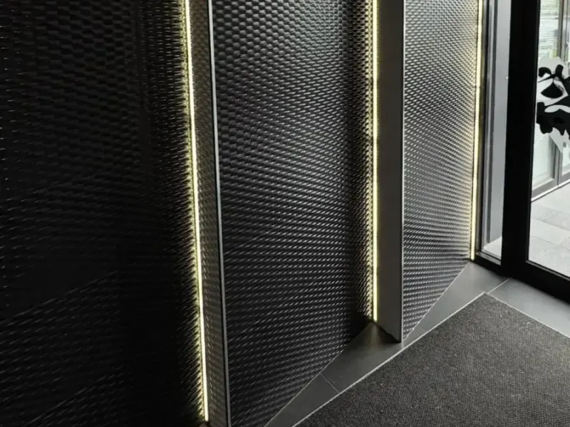Feature entrance lighting in a Melbourne apartment building common area by Accorto Electrical